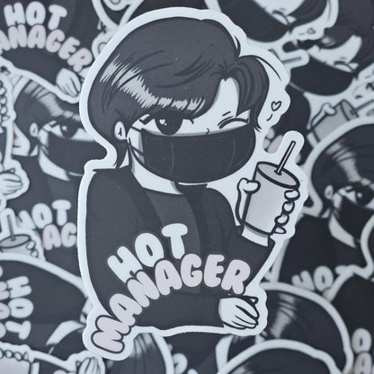 Sticker of a person wearing a mask with 'HOT MANAGER' text, surrounded by similar stickers.